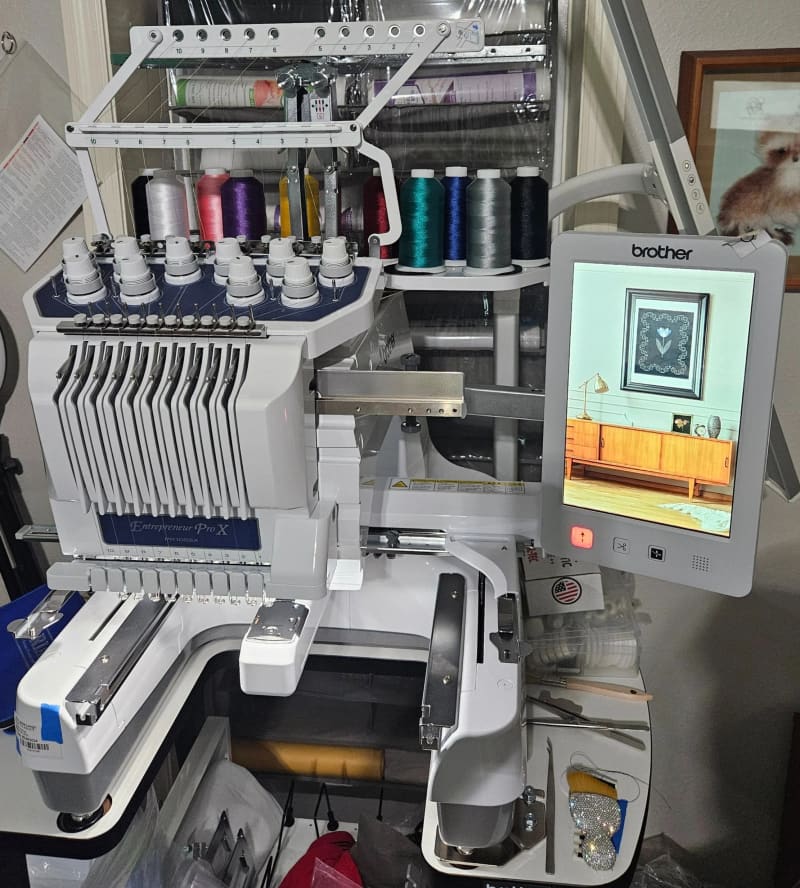 Brother 10-needle embroidery machine with spools of thread